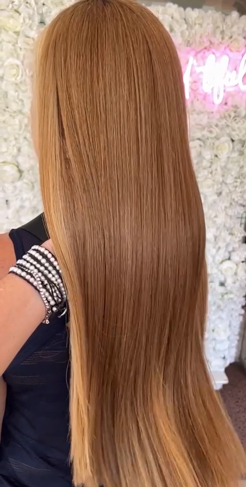 After — sleek, glass-straight copper hair after Japanese thermal straightening at White Sand Salon